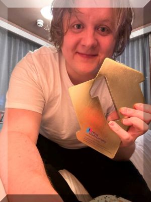 Lewis Capaldi poses with his Official Number 1 Album Award for Broken By Desire To Be Heavenly Sent (credit: Official Charts Company)