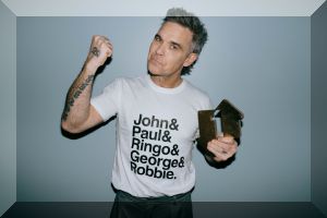 Robbie Williams celebrates his Official Number 1 album Better Man with an Official Number 1 Award (credit: Leo Baron) Robbie Williams celebrates his Official Number 1 album Better Man with an Official Number 1 Award (credit: Leo Baron)